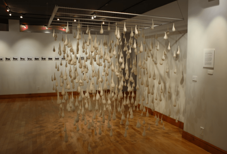 Seventy times Seven represents the inward journey through emotion. It is 490 crocheted tears suspended from a frame, 7 X 7, hung 7 feet off the floor, to create a perfect cube symbolic of the natural attempt to contain the pain. Each tear is crocheted by hand without any pattern making each one unique, a reflection of the moment of its creation. The color white symbolizes the purity and simplicity of the falling of a tear. The tears also portray an understanding of the answer to Peterβs questionβ¦ βSir, how often should I forgive a brother who has sinned against me? Seven times?β Christβs answer was seventy times seven, 490 times. This is one day.